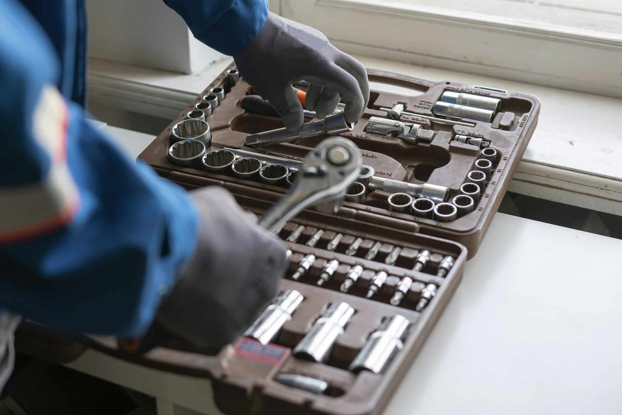 a professional worker taking the instrument tool from the toolbox set